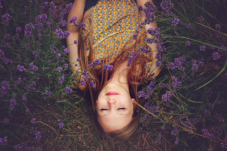 Girl laying in field