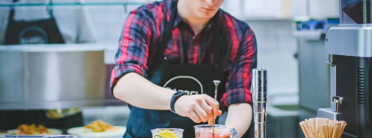 staff member in embroidered business uniform