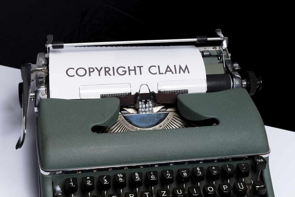 typewriter with copyright claim text