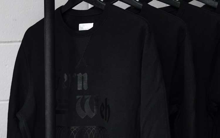 black print on black sweatshirt