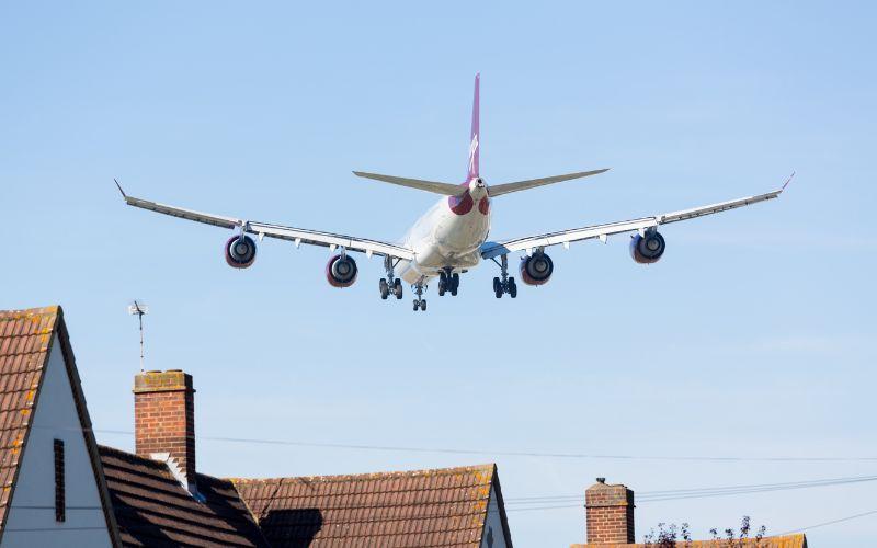 Virgin Plane Over Houses.