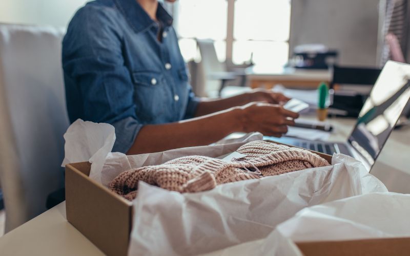 YouTuber packing merchandise.