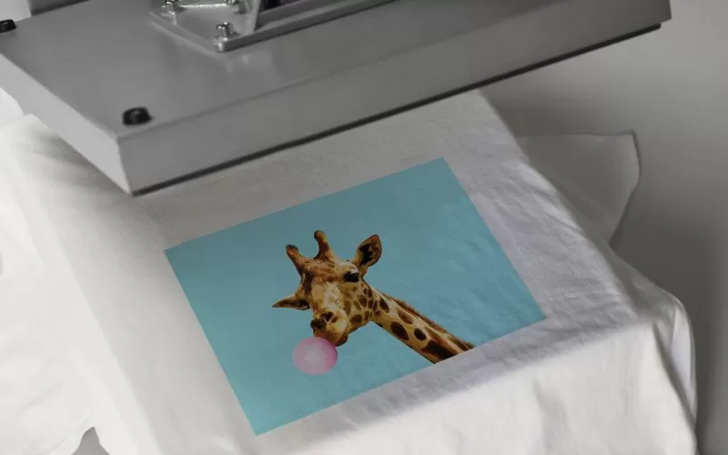 T.shirt in heat press, vibrant print.