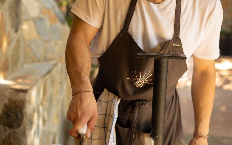 Apron with a logo on, chef cooking.