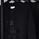 black print on black sweatshirt