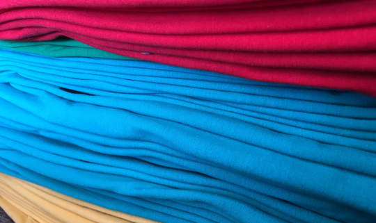 custom printed t-shirts stacked up