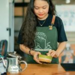 Cafe employee wearing an apron.